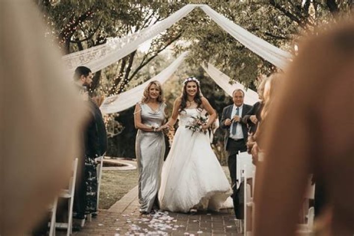 How do two brides walk down the aisle?