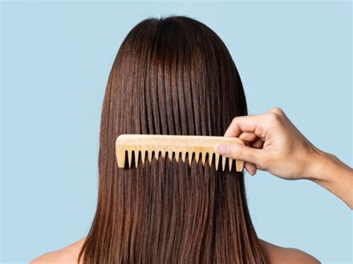 Should you comb conditioner through your hair?