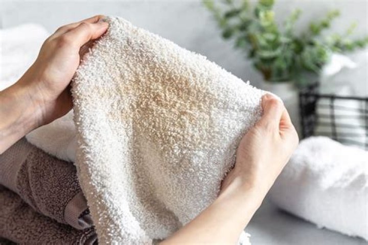 Why do my towels smell musty after washing?