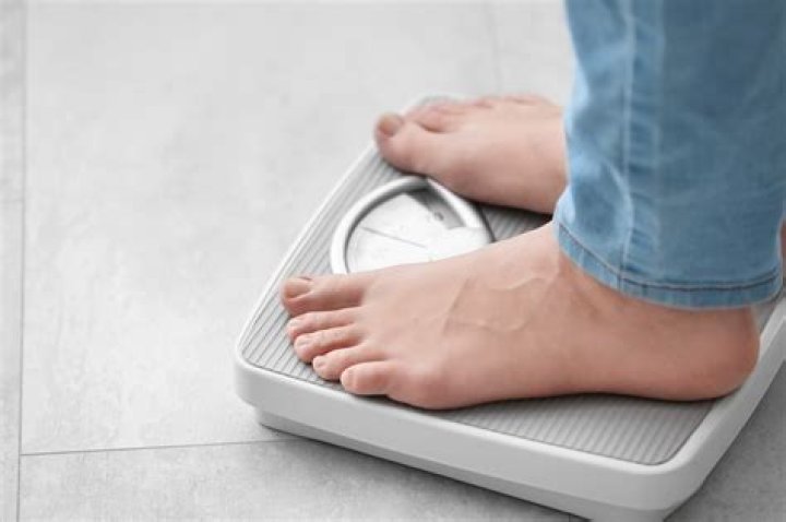 Why do we weigh less after a shower?